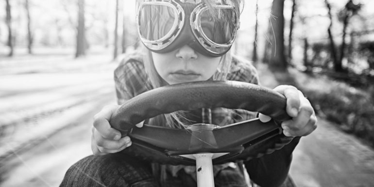 Girl with goggles driving